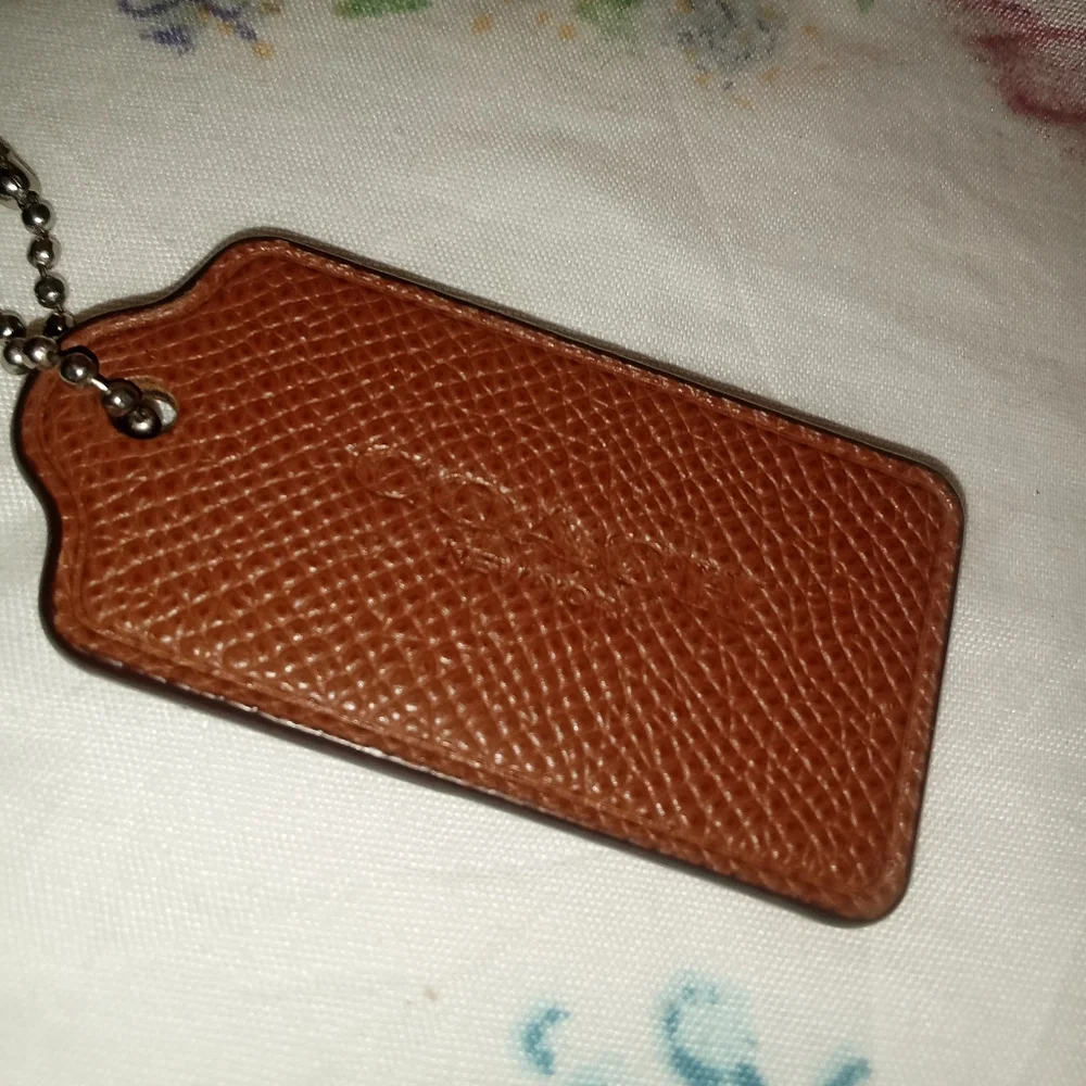 Coach brown hang tag